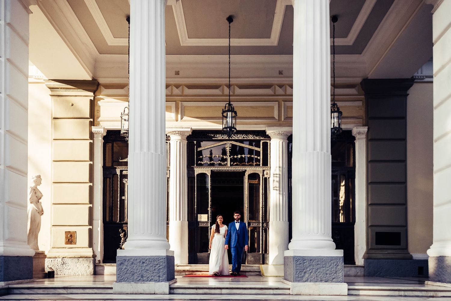 Classical white colonnade architecture with elegant pillars and archways.