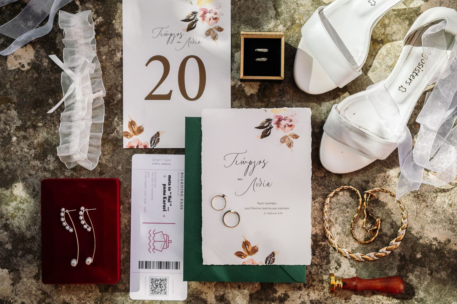 Wedding day details and stationery featuring floral designs and table numbers.