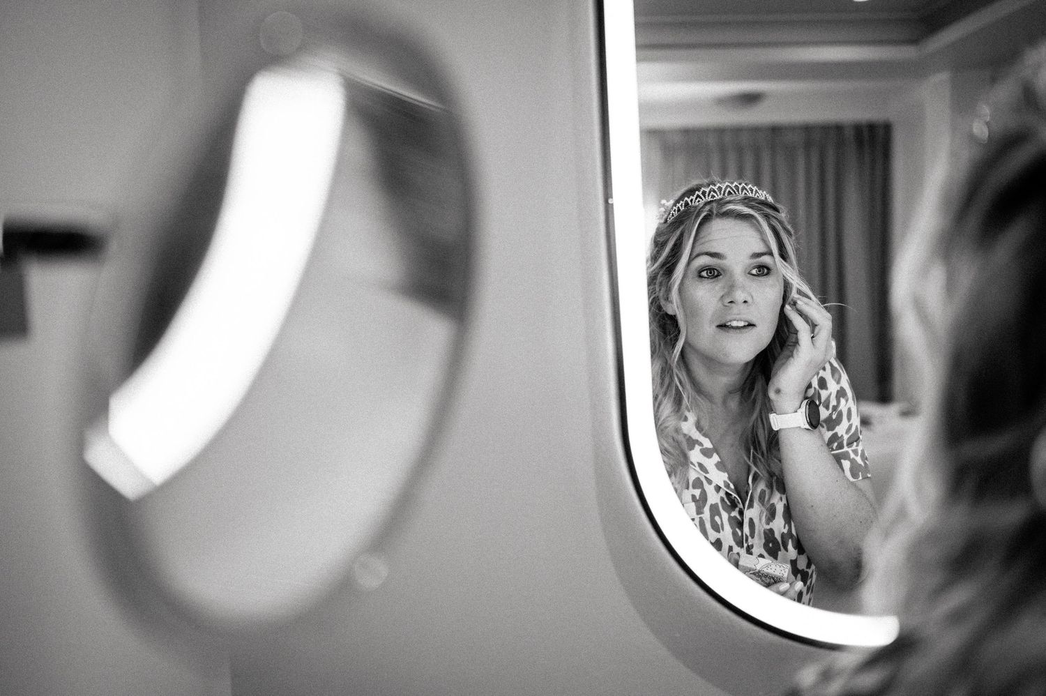 Close-up artistic black and white portraits through window reflections creating dreamy atmosphere.