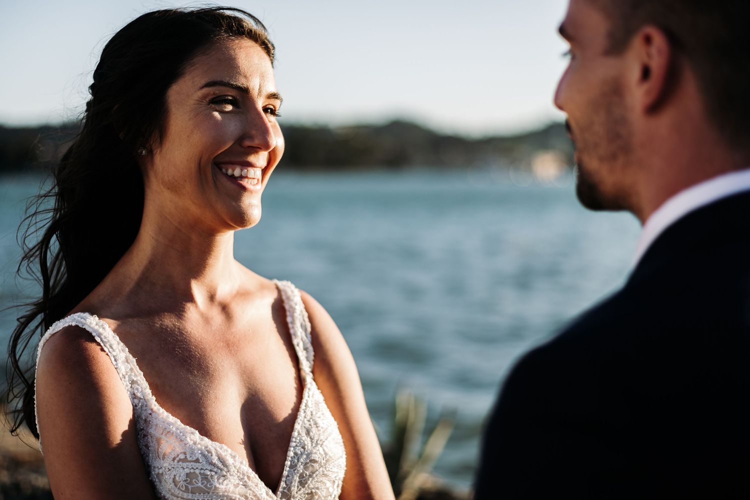 Intimate wedding portraits captured against a beautiful ocean backdrop.