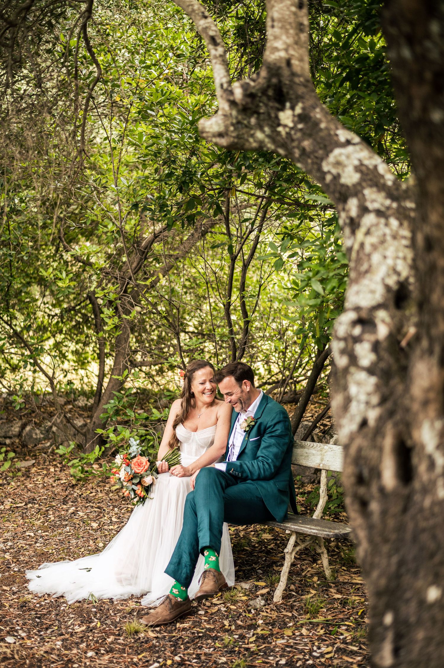 Intimate wedding portraits captured in a secluded garden setting.