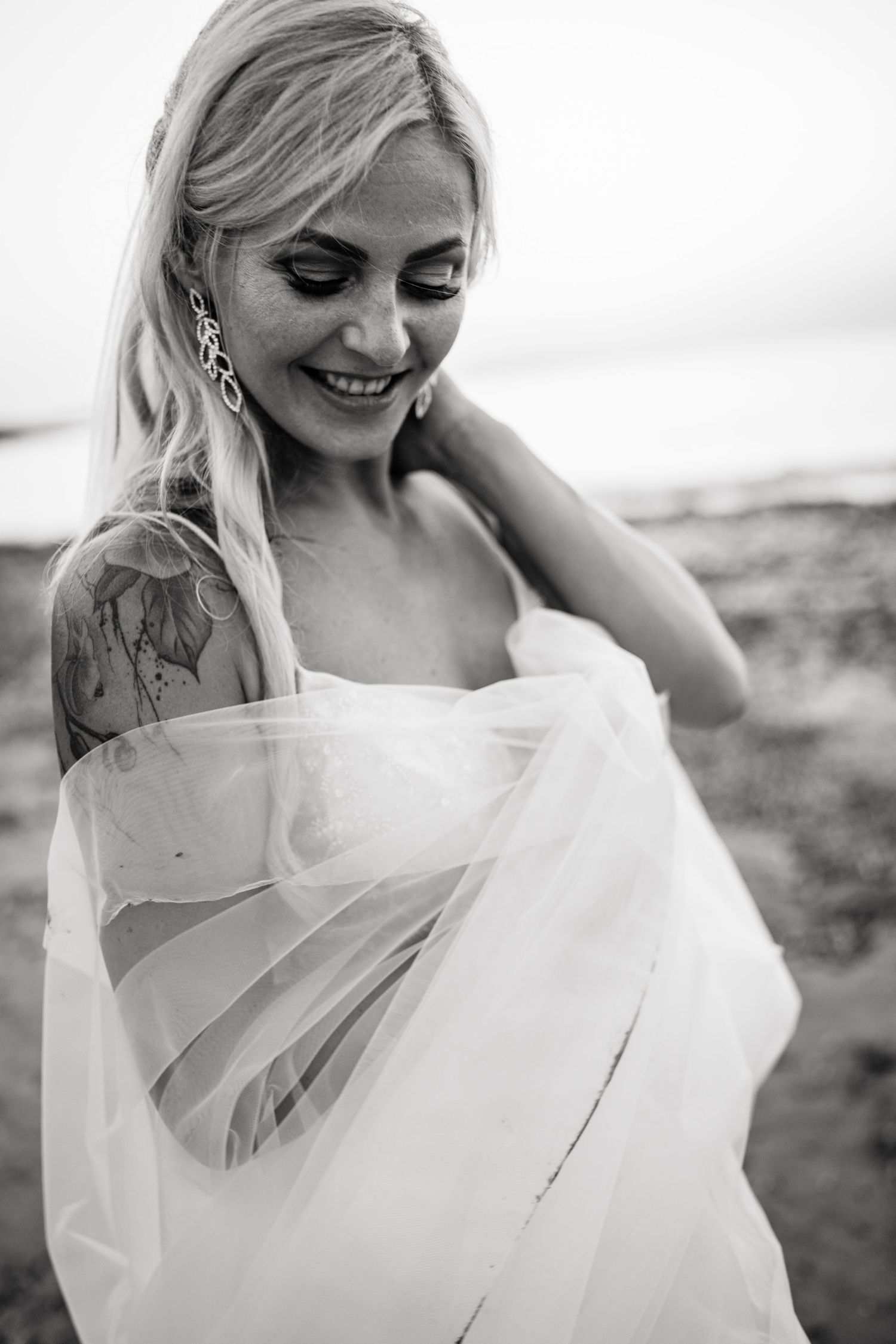 Ethereal bridal portraits featuring flowing white fabric and natural light.