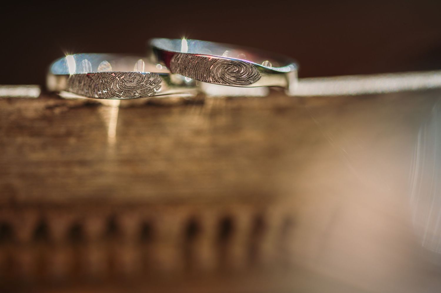 Artistic macro shot of wedding rings with shallow depth of field.