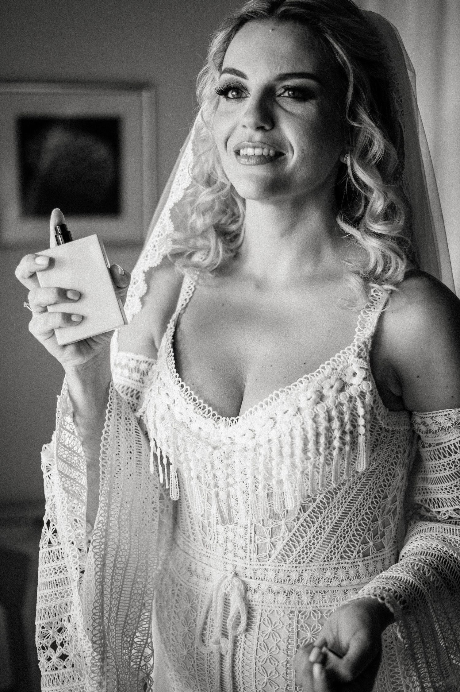 Close-up details of an intricate white beaded wedding dress.