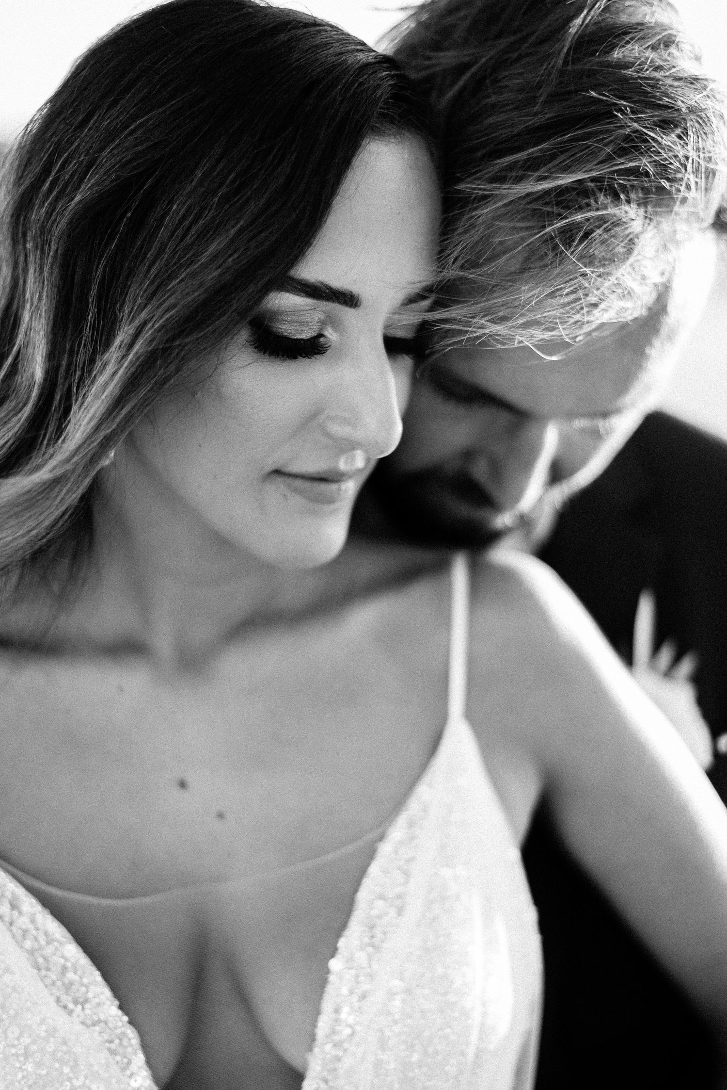 Black and white close-up portrait series showing soft romantic details.