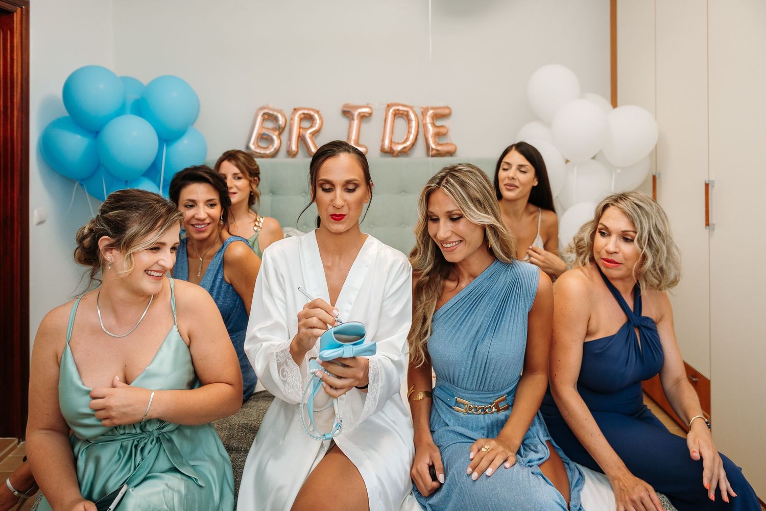 Celebration scene with blue balloons and party decorations.