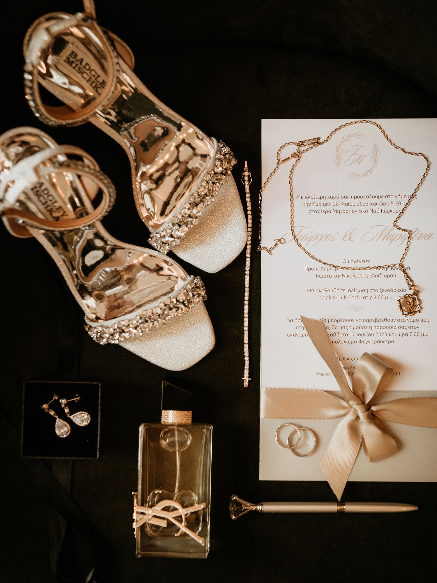 Wedding detail shots of jewelry, invitations, and accessories arranged artistically in warm sepia tones.