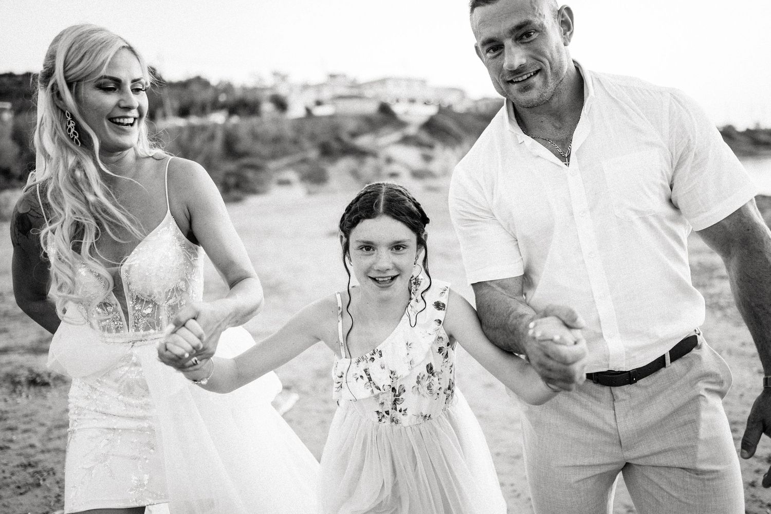 Black and white wedding photos showing candid moments of celebration and laughter.