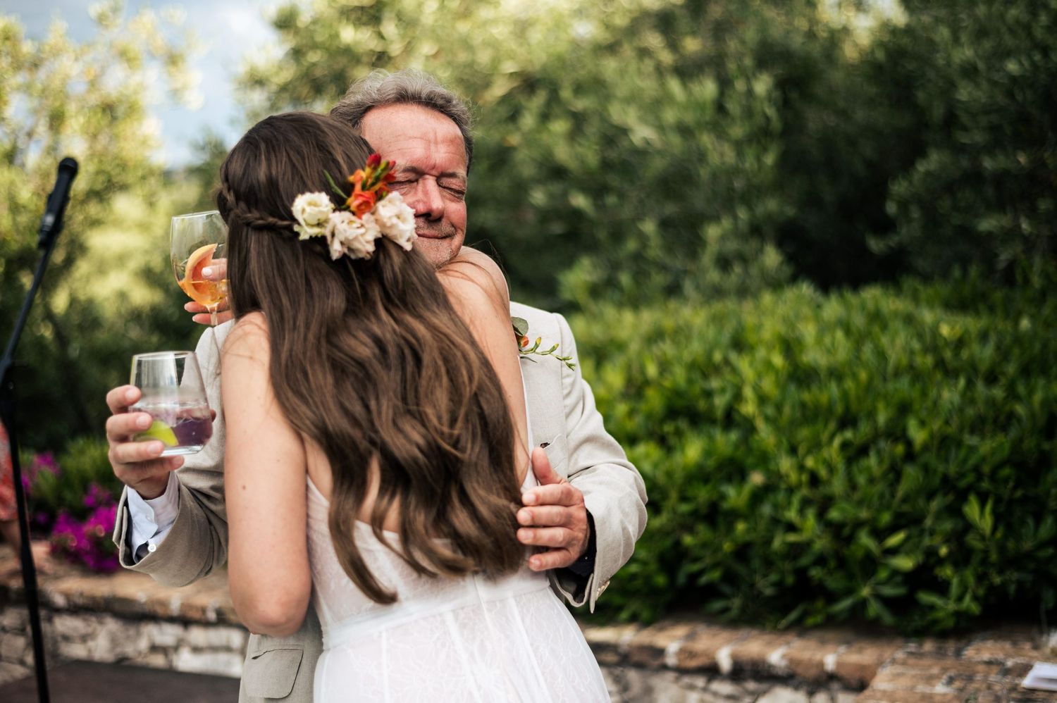 Romantic outdoor wedding dance with floral details and natural garden backdrop.