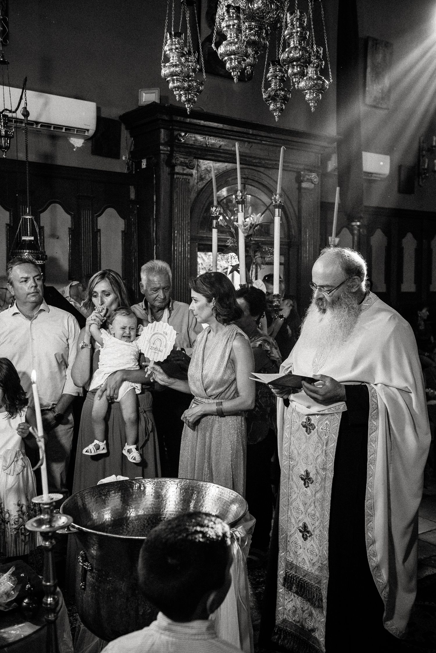 Black and white photos of clergy performing religious ceremony in traditional robes.