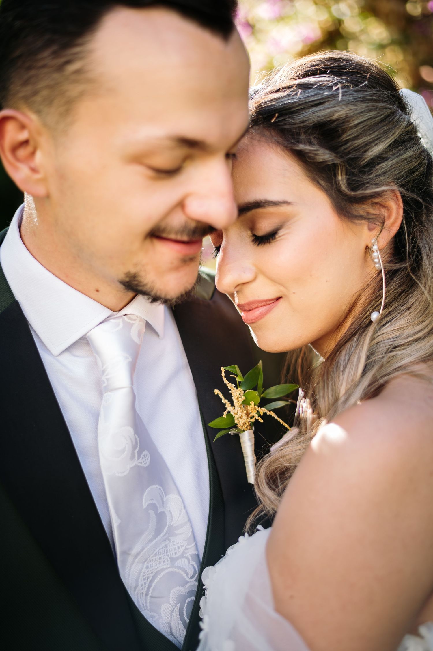 Intimate close-up wedding portraits showing tender moments between the couple.