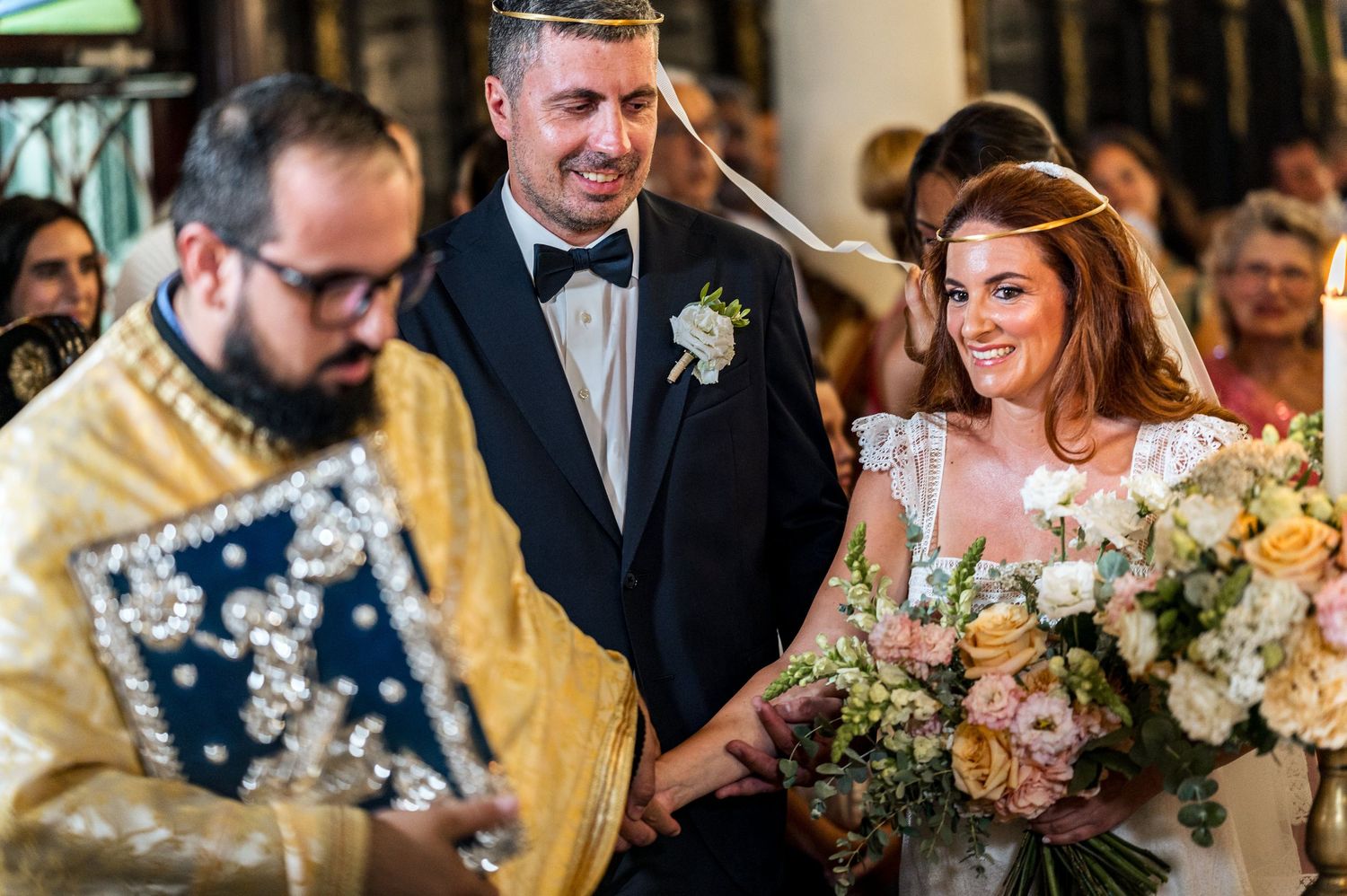 Joyful moments captured during a wedding ceremony with elegant floral arrangements.