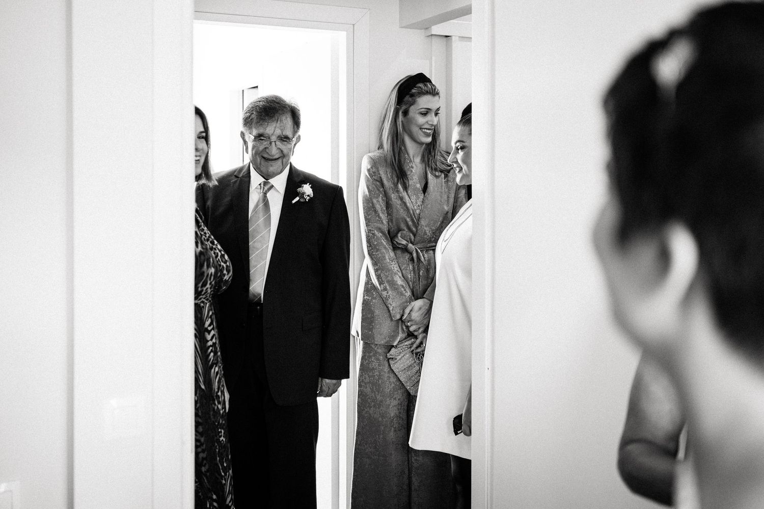 Elegant wedding preparations captured in a series of candid black and white photographs.