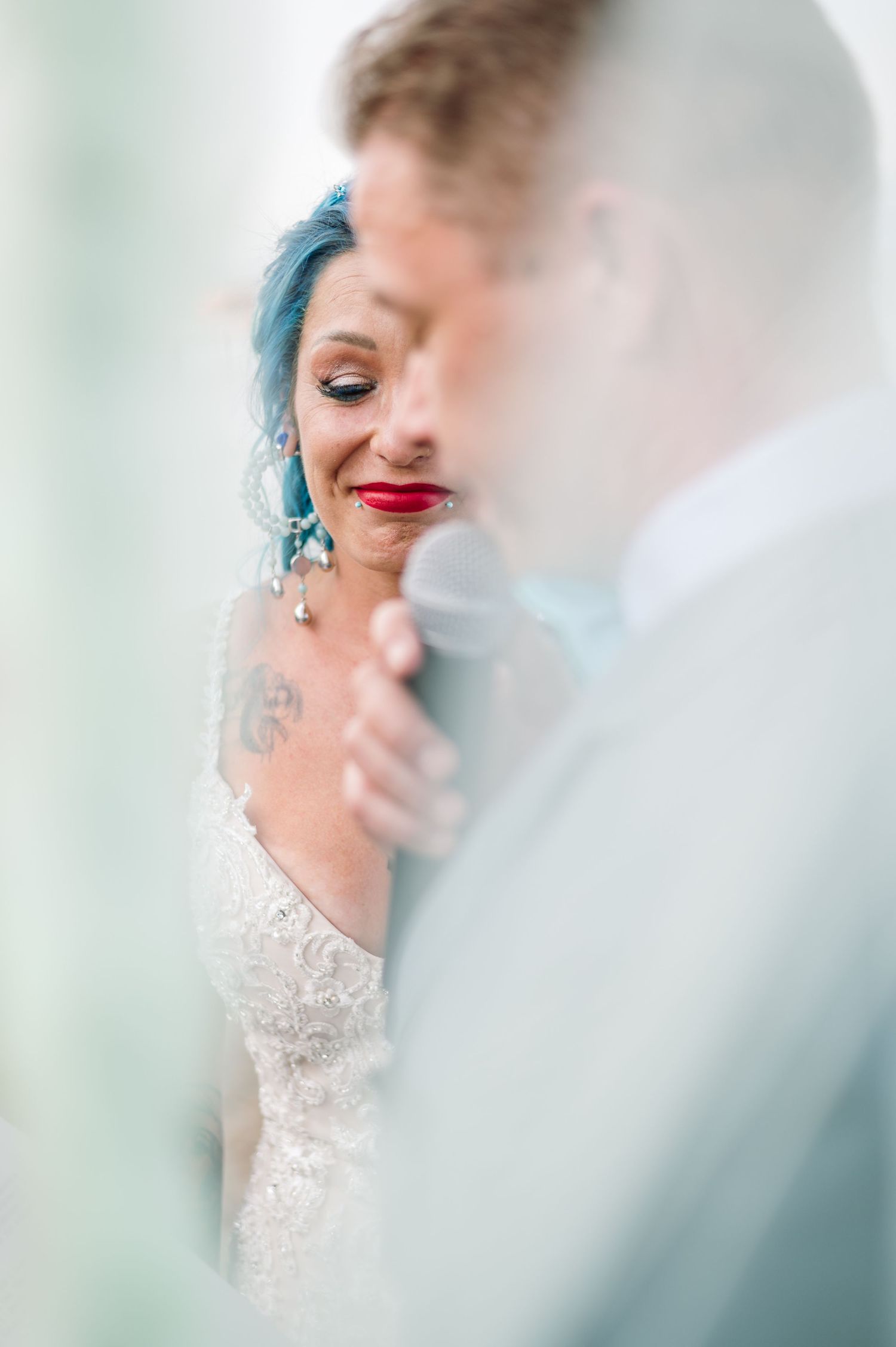 Dreamy, soft-focus wedding portraits with ethereal light and delicate details.