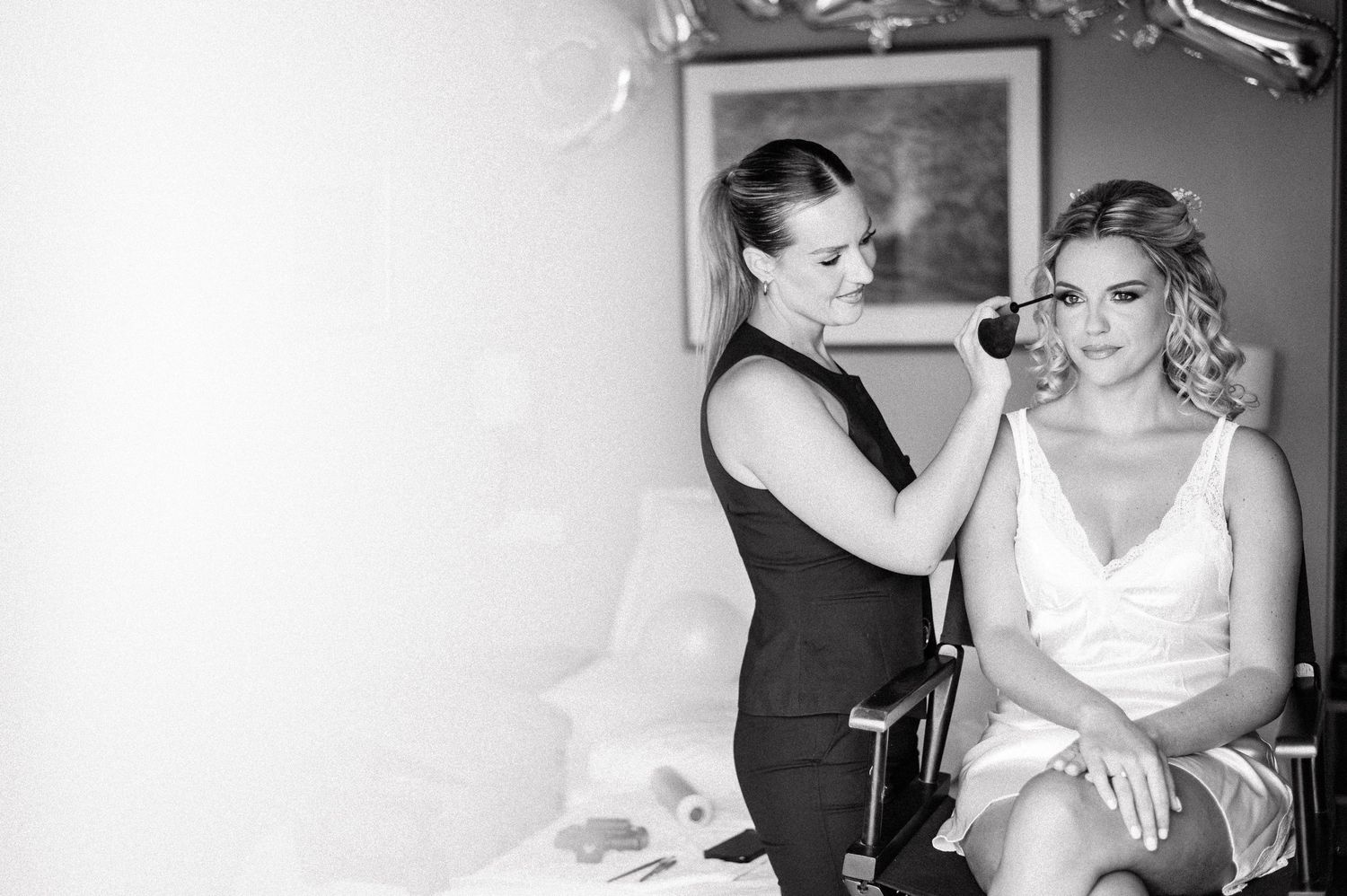 Black and white candid moments during wedding preparations.