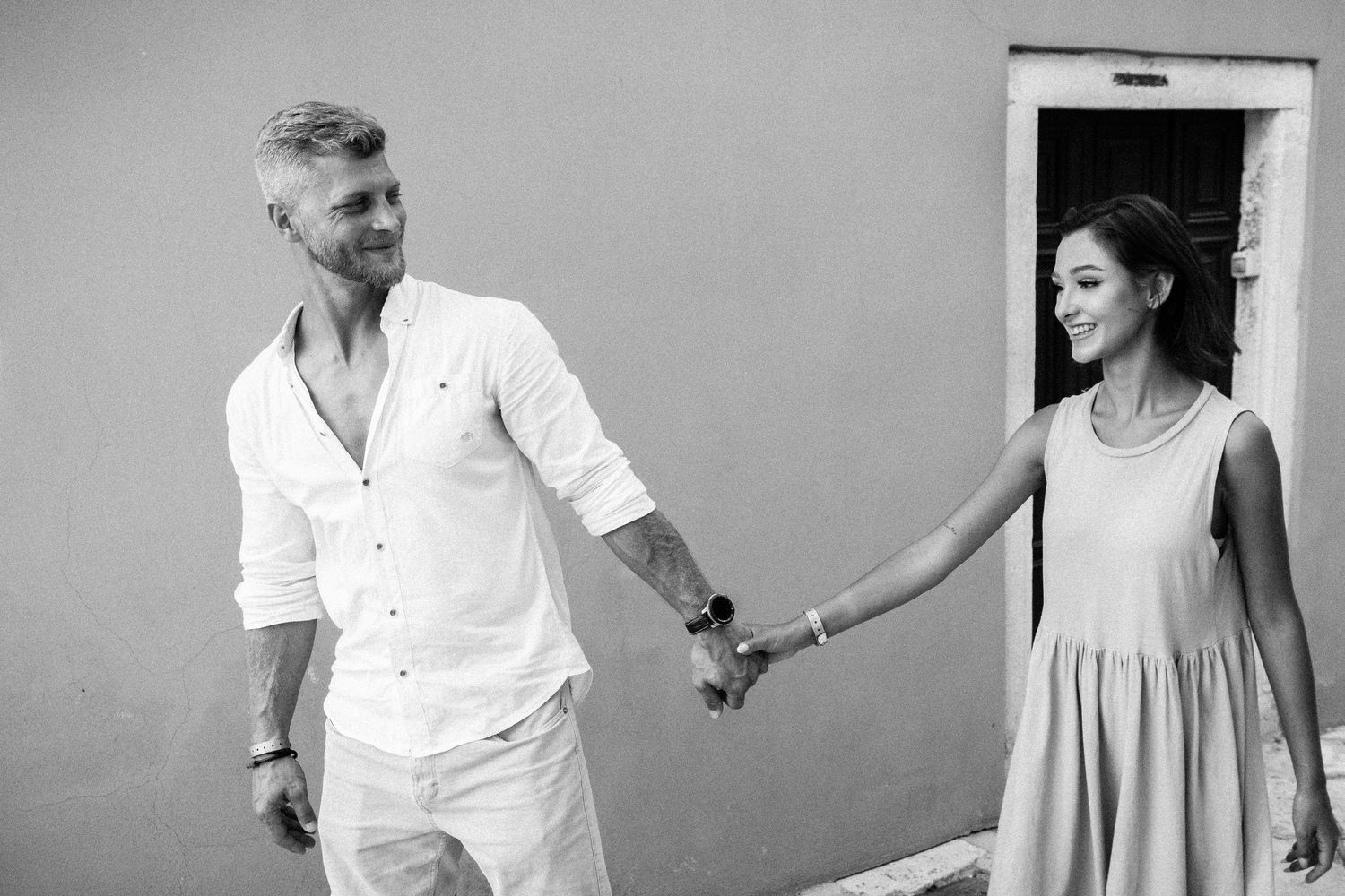 Romantic black and white sequence of a couple dancing and twirling in elegant attire.
