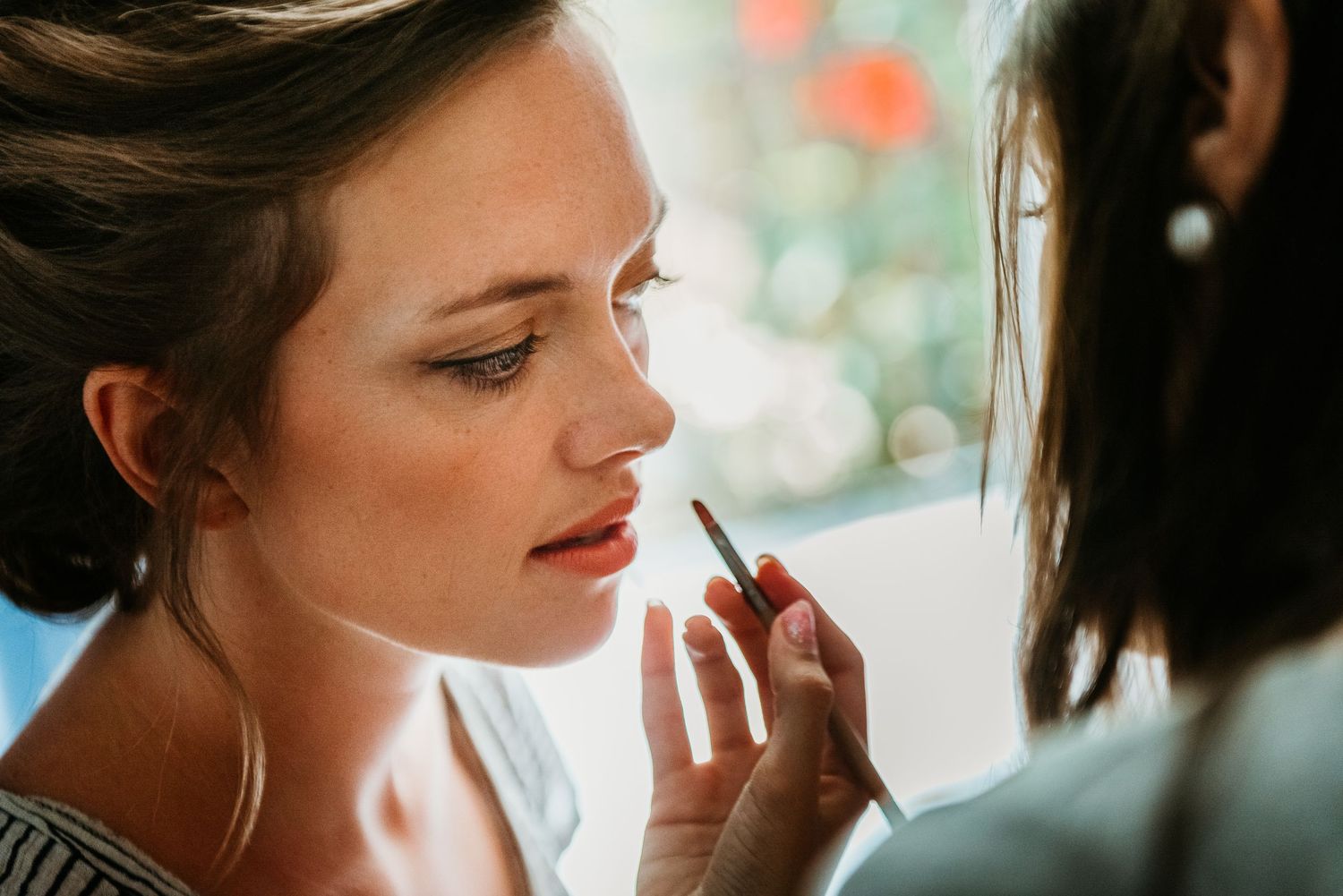 Artistic wedding photography closeups with warm lighting and natural expressions.