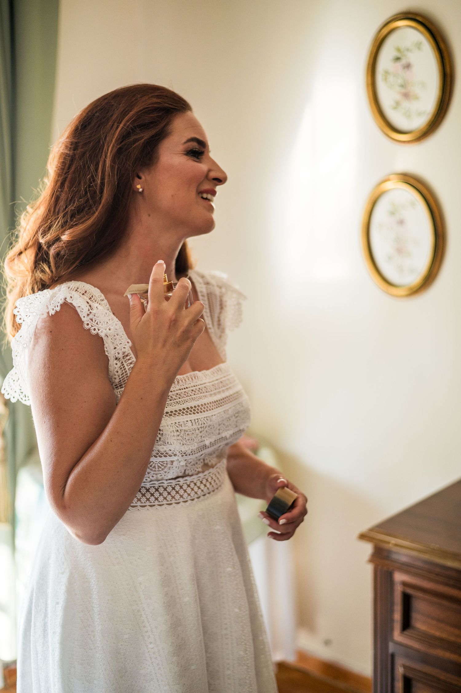Candid photos showing laughter and preparation moments against a wall with oval frames.
