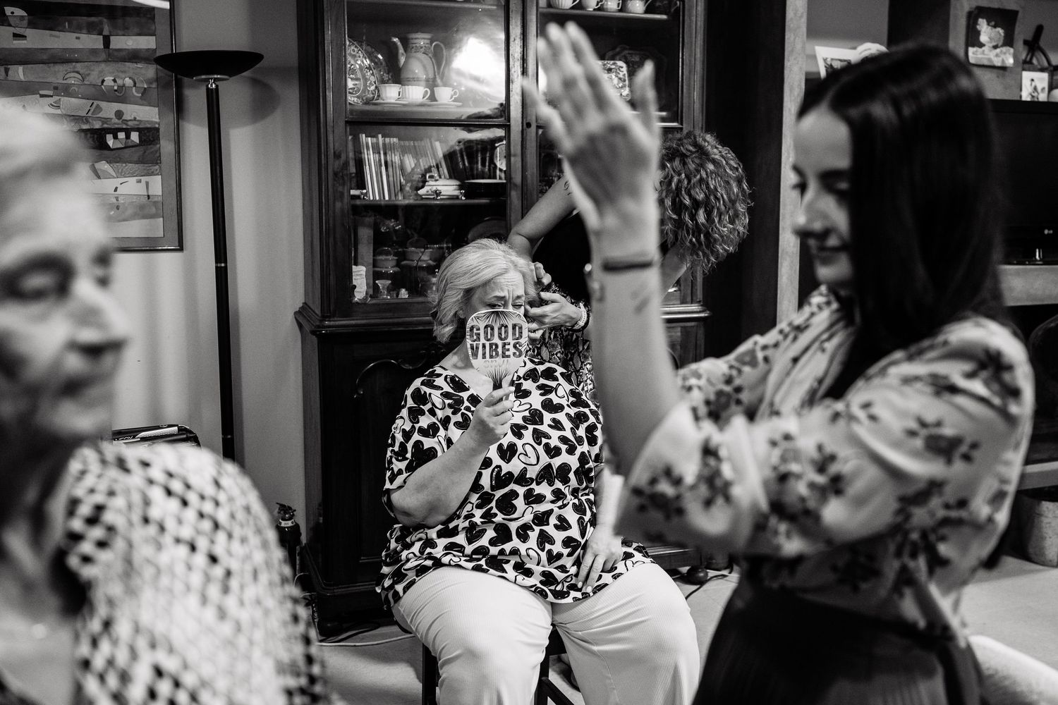 Black and white sequence showing joyful candid moments at a celebration with polka dot patterns.