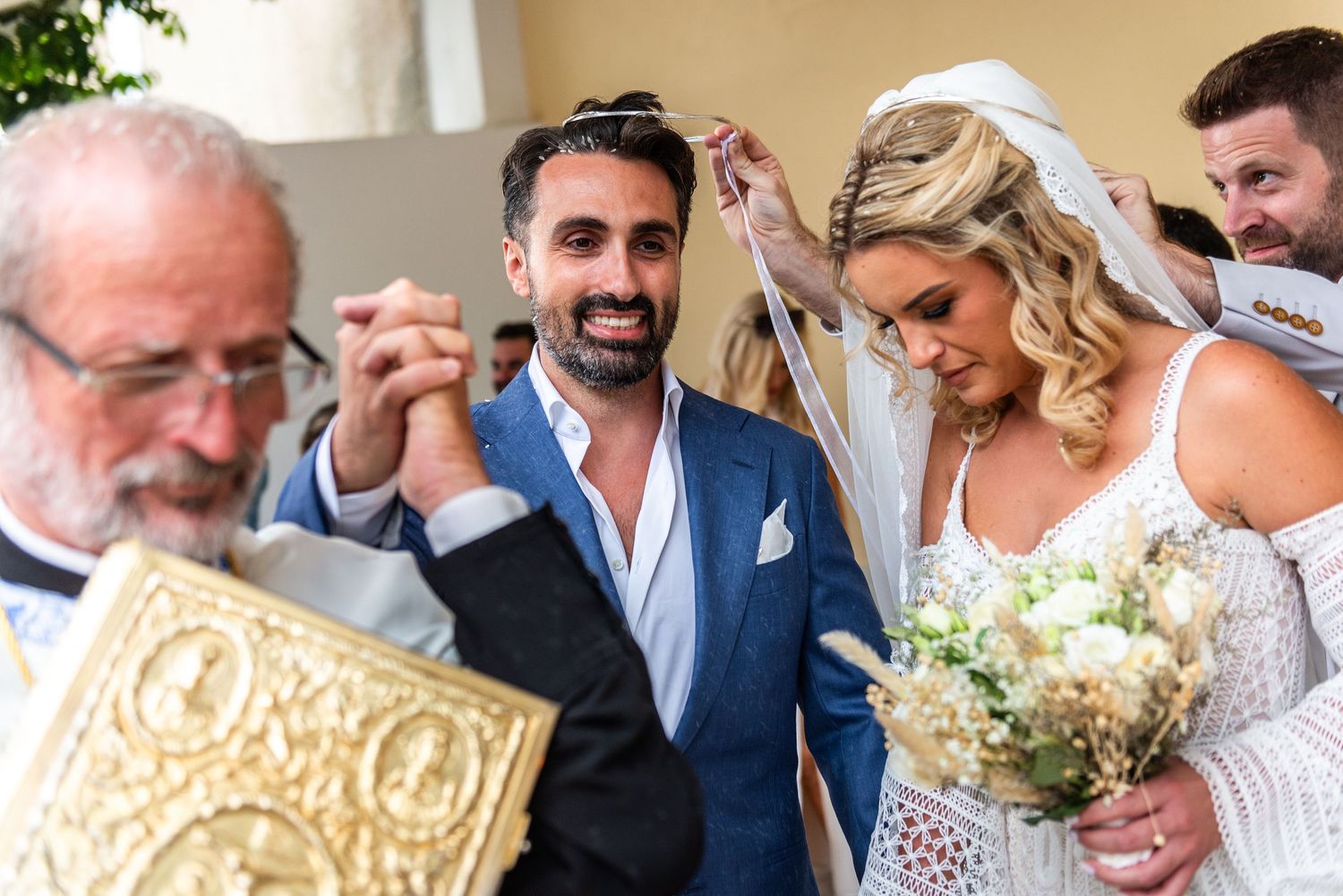 Wedding celebration with guests enjoying candid moments outdoors.
