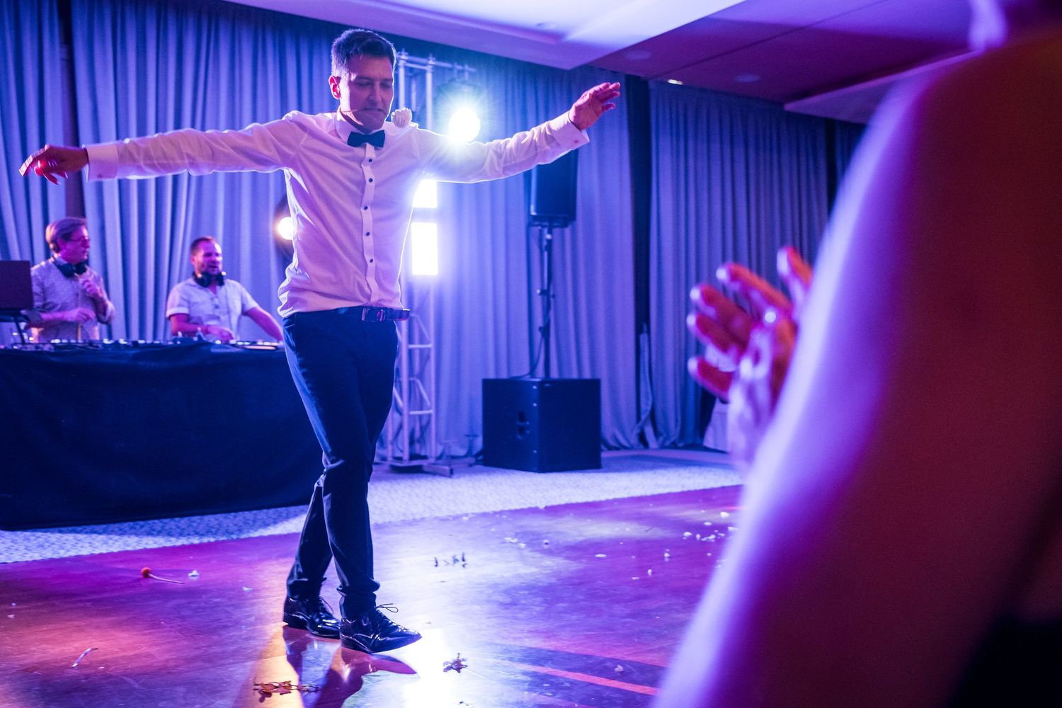 Dance floor illuminated with blue theatrical lighting creates dramatic reception atmosphere.