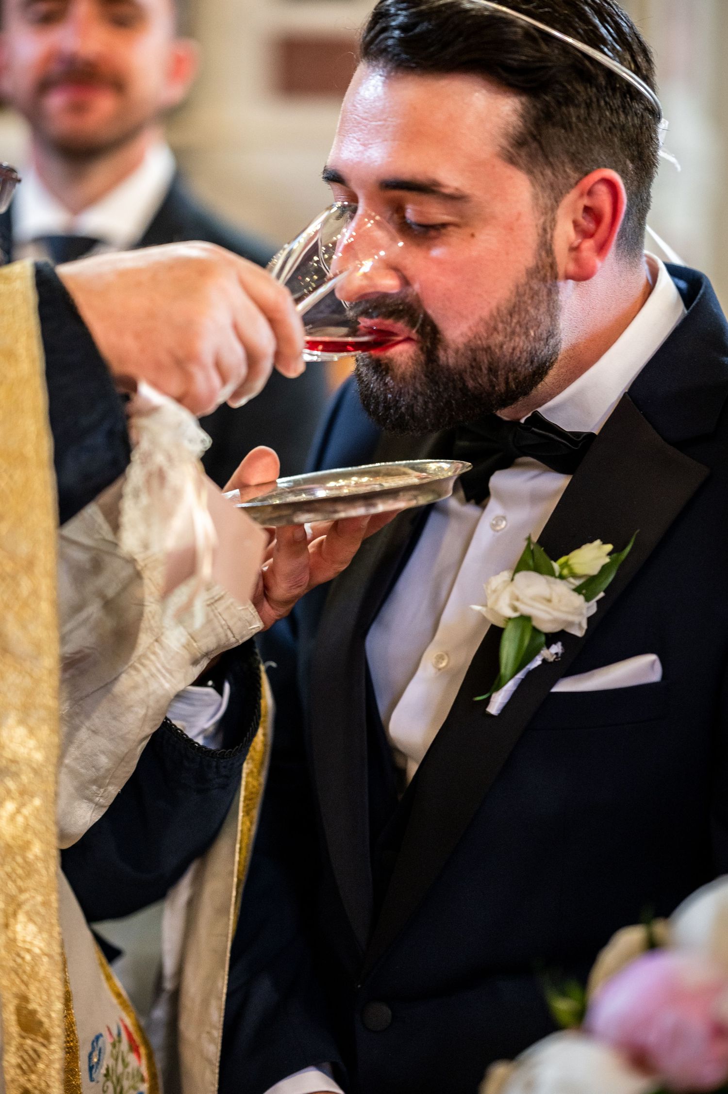Series of shots showing groomsmen drinking champagne during wedding celebrations.