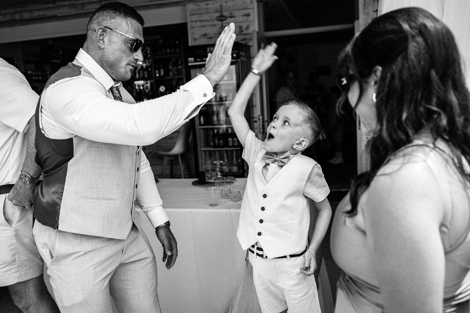 Wedding reception dance floor with guests celebrating in black and white.