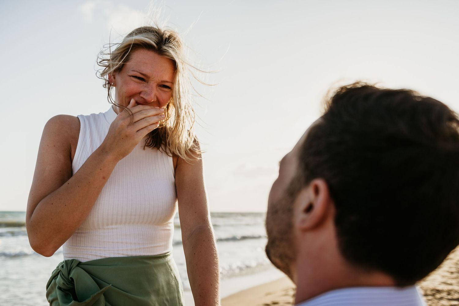 Emotional beach scene capturing genuine laughter and joy.