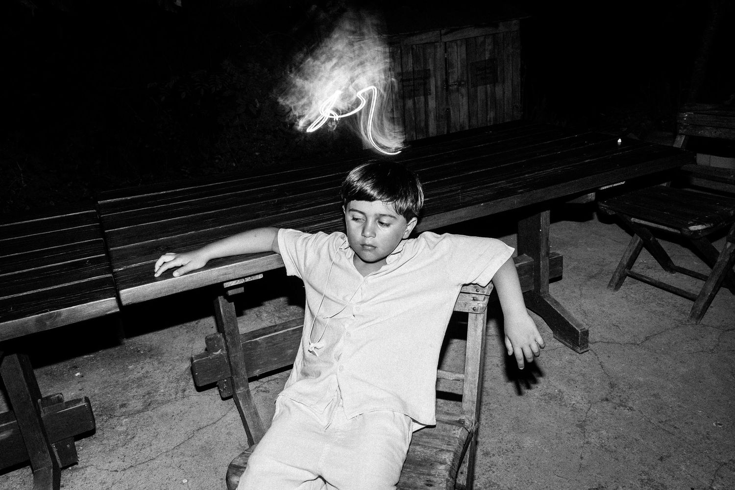 Black and white photos show energetic dance moves at a nighttime celebration.