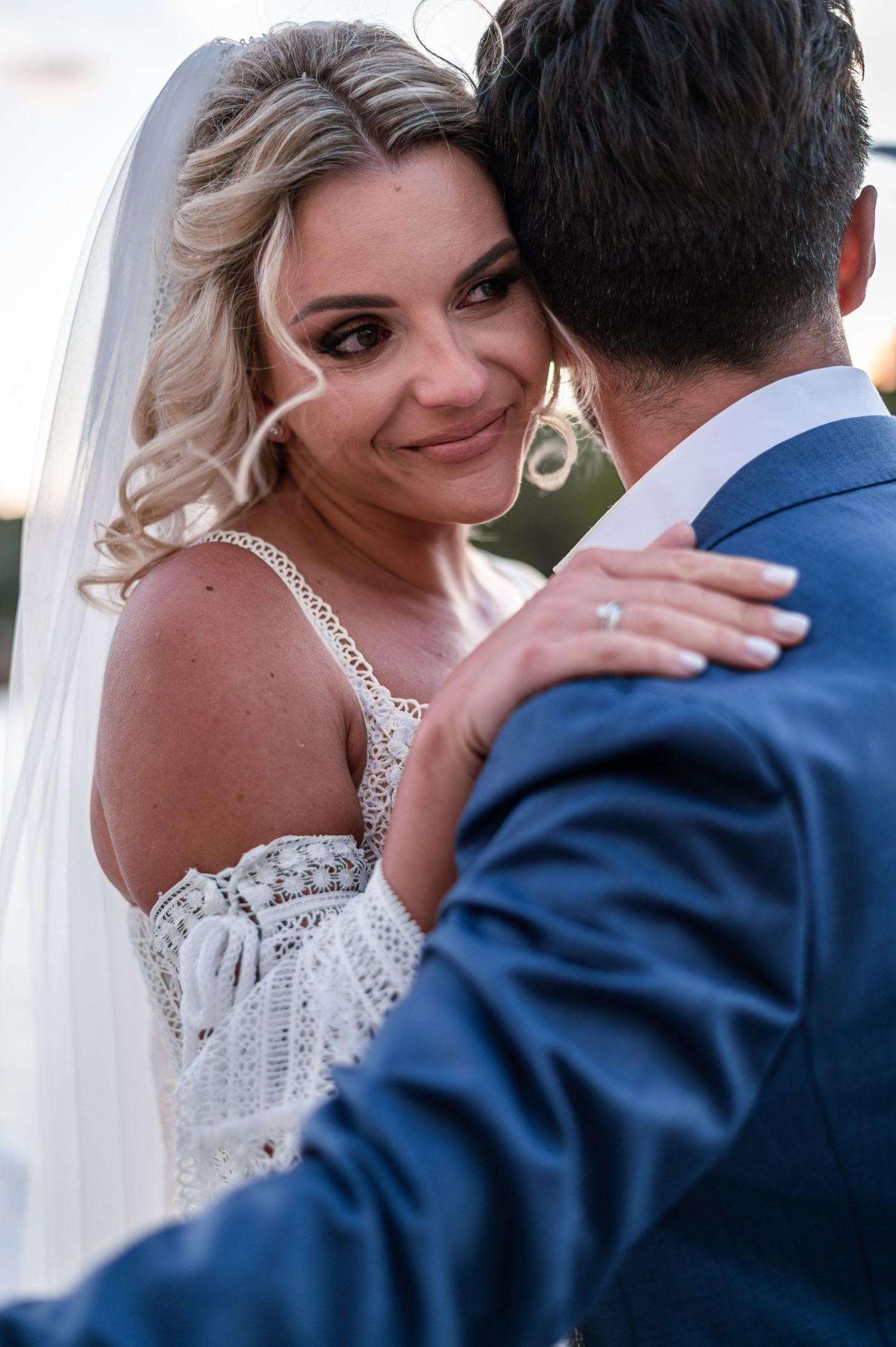 Romantic wedding couple shares intimate moments in a series of close-up portraits.