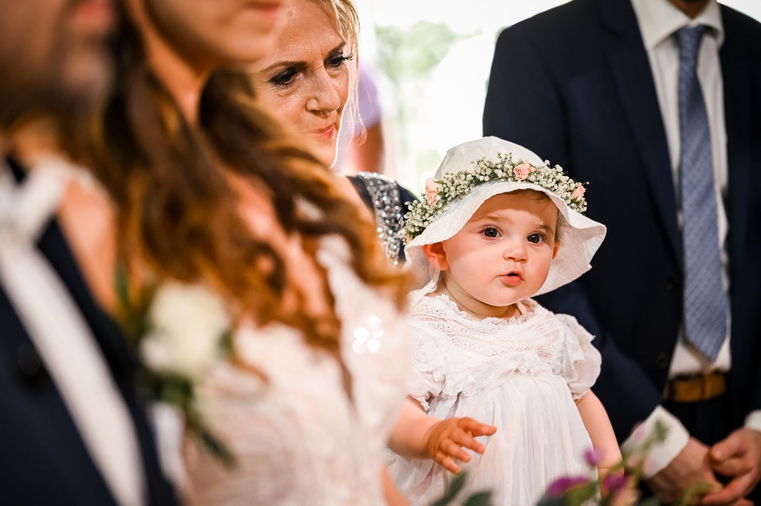 Wedding party members in formal attire during an elegant celebration.