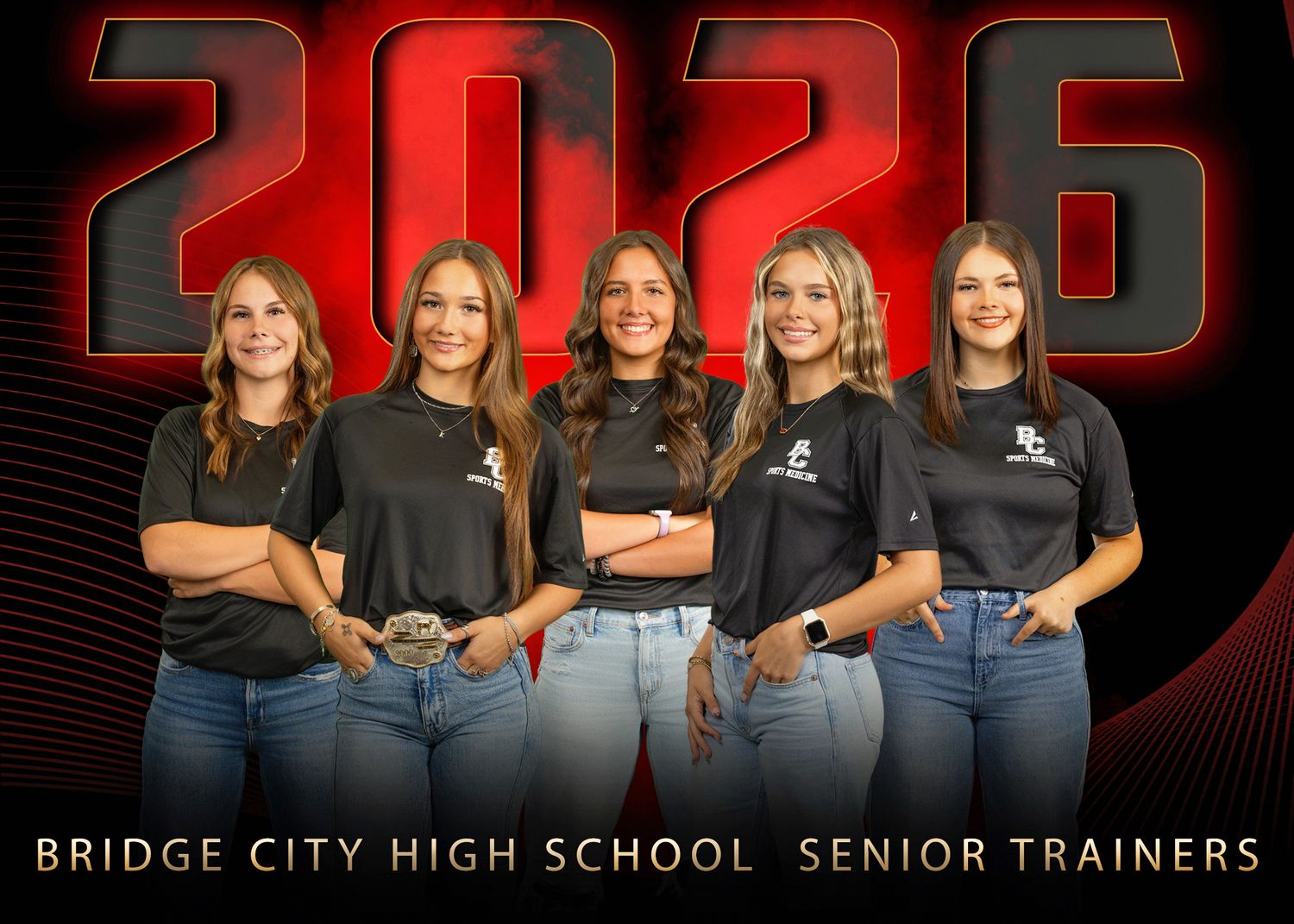 Five Senior athletic trainers in black shirts and jeans pose together against a red and black backdrop with school name displayed.
