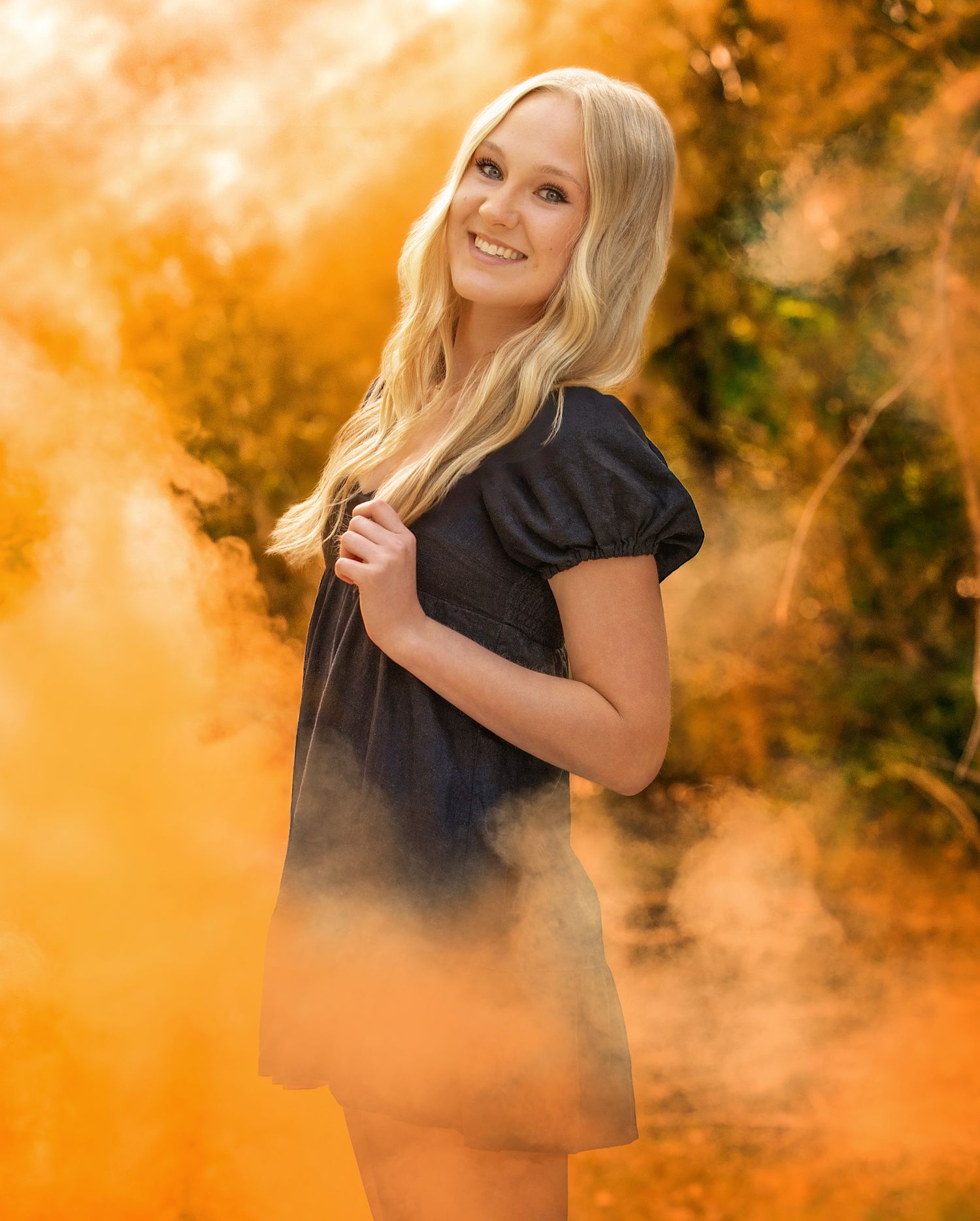 Artistic outdoor photoshoot with warm autumn colors and golden lighting effects.