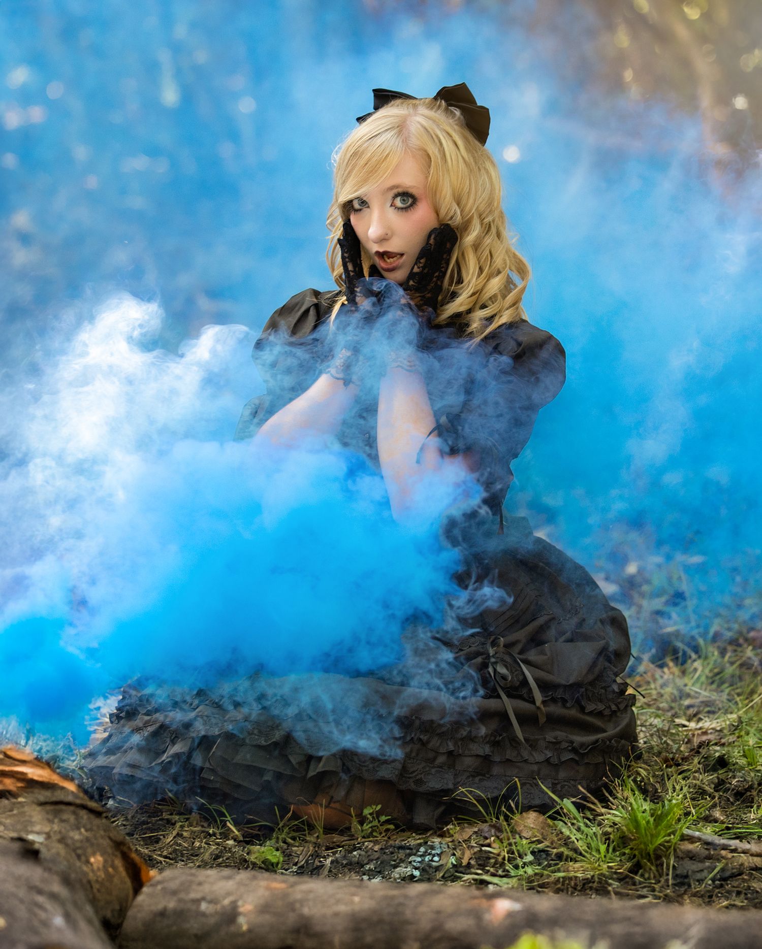 Artistic photo series with blue smoke effects creating a dramatic atmosphere in an outdoor setting.