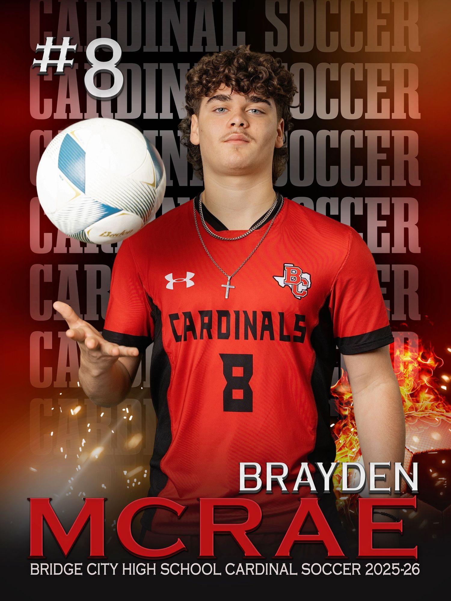 Soccer player wearing red Cardinals jersey number 8 poses with ball against fiery team backdrop.