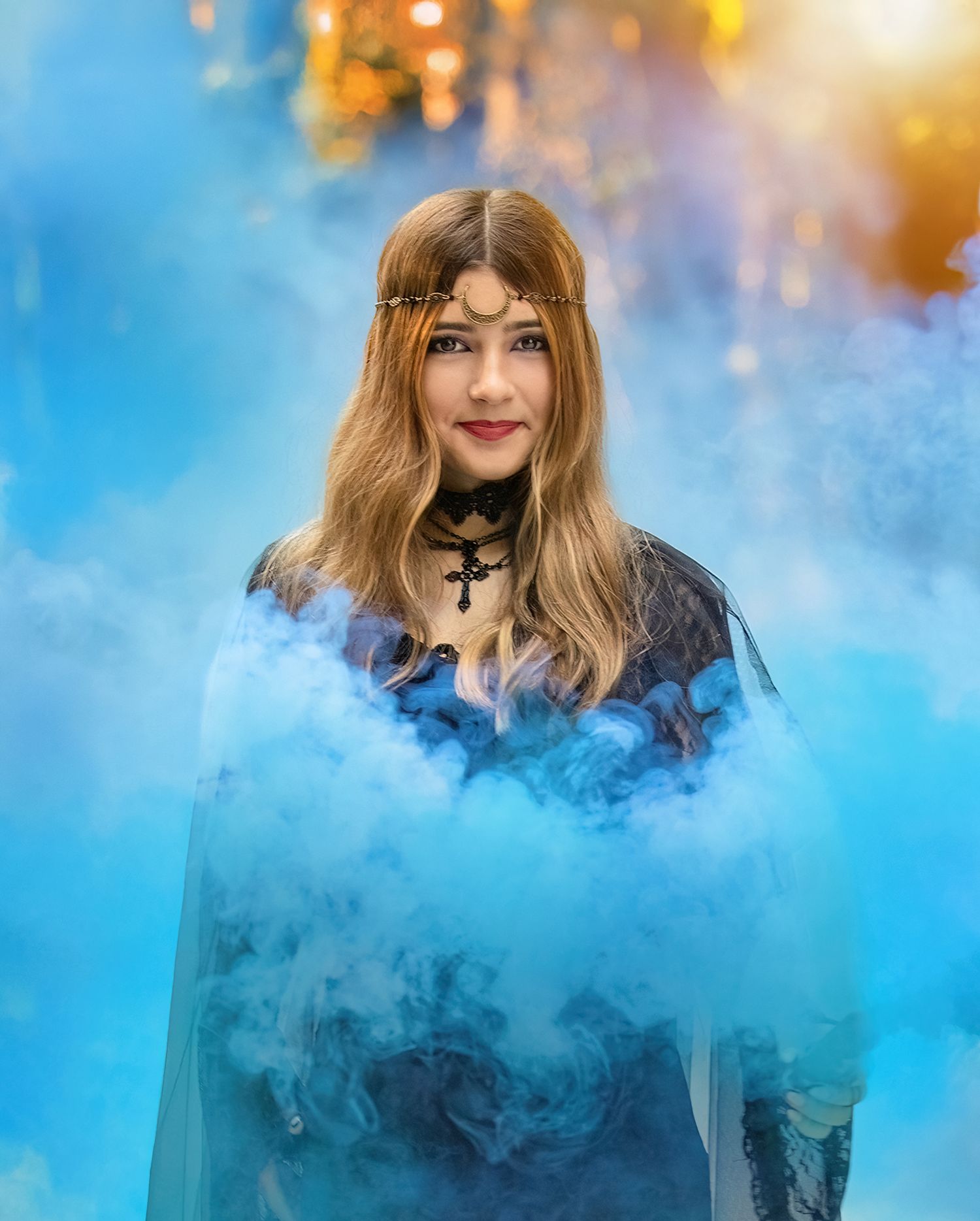 Ethereal portrait with blue smoke effects against autumn backdrop.