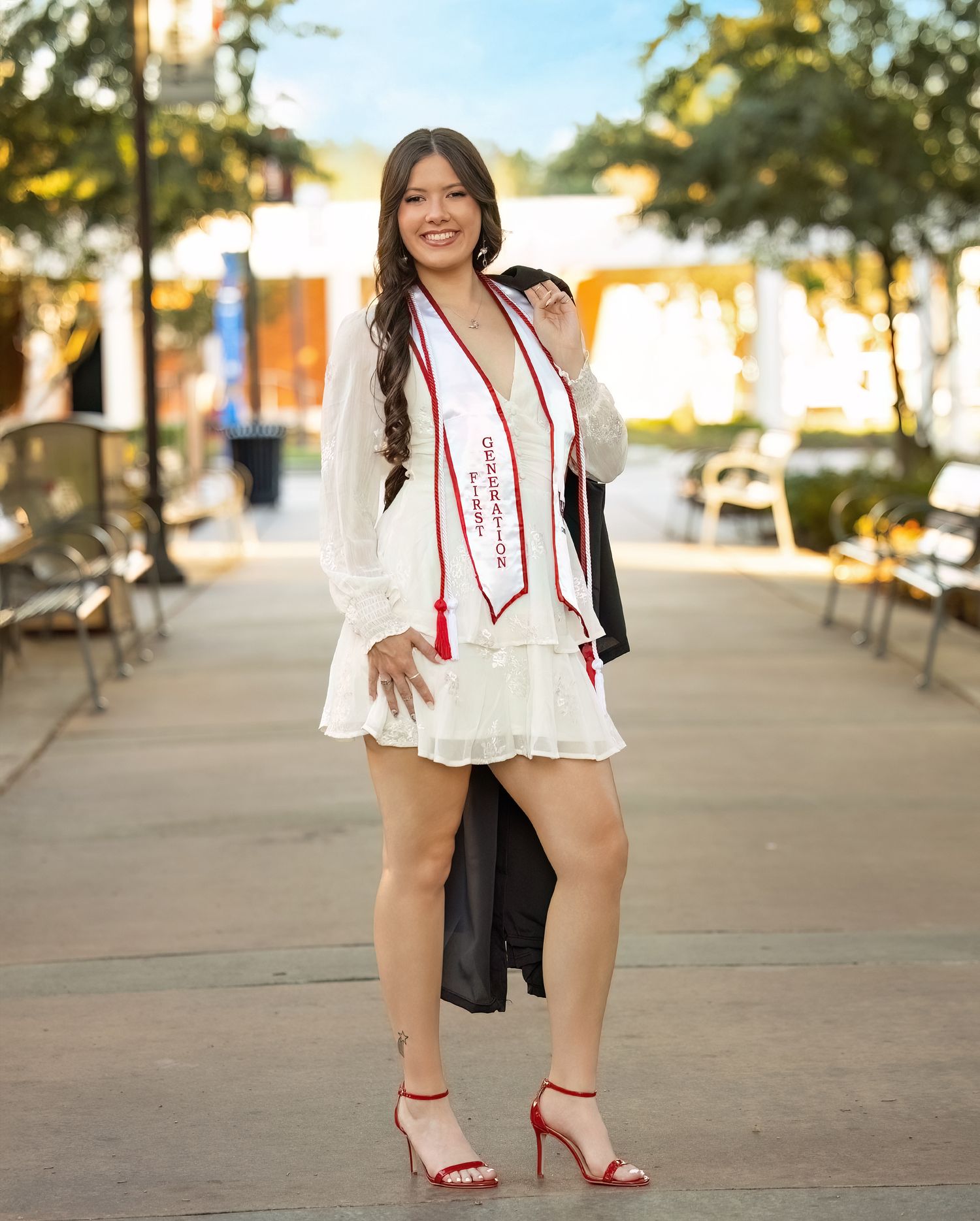 A series of outdoor portraits showing someone in a white dress with red accents posing on a sunlit path with trees.