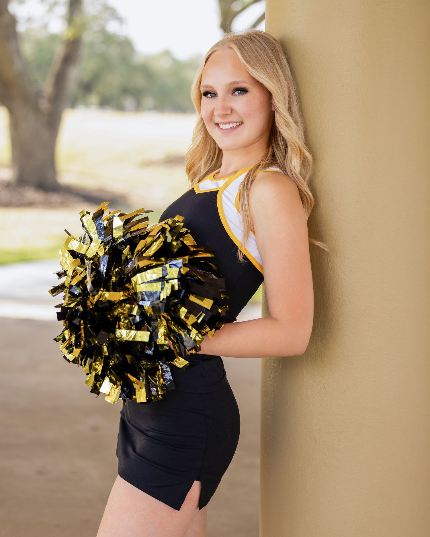 Lynsie's  black and gold uniform is the perfect Sports and Spirit Session outfit.  Vidor Senior 2026