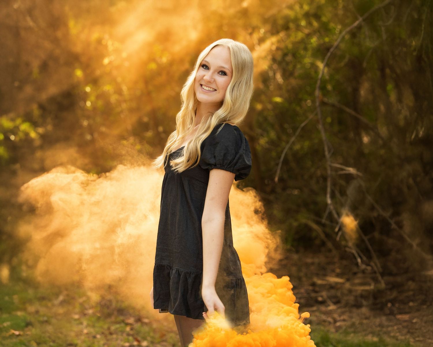 Lynsie at a Senior photoshoot with the backlight and smoke bombs was incredible