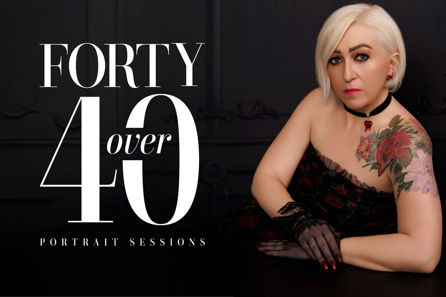 Glamour portrait session featuring model in black dress with floral tattoo against dark backdrop.