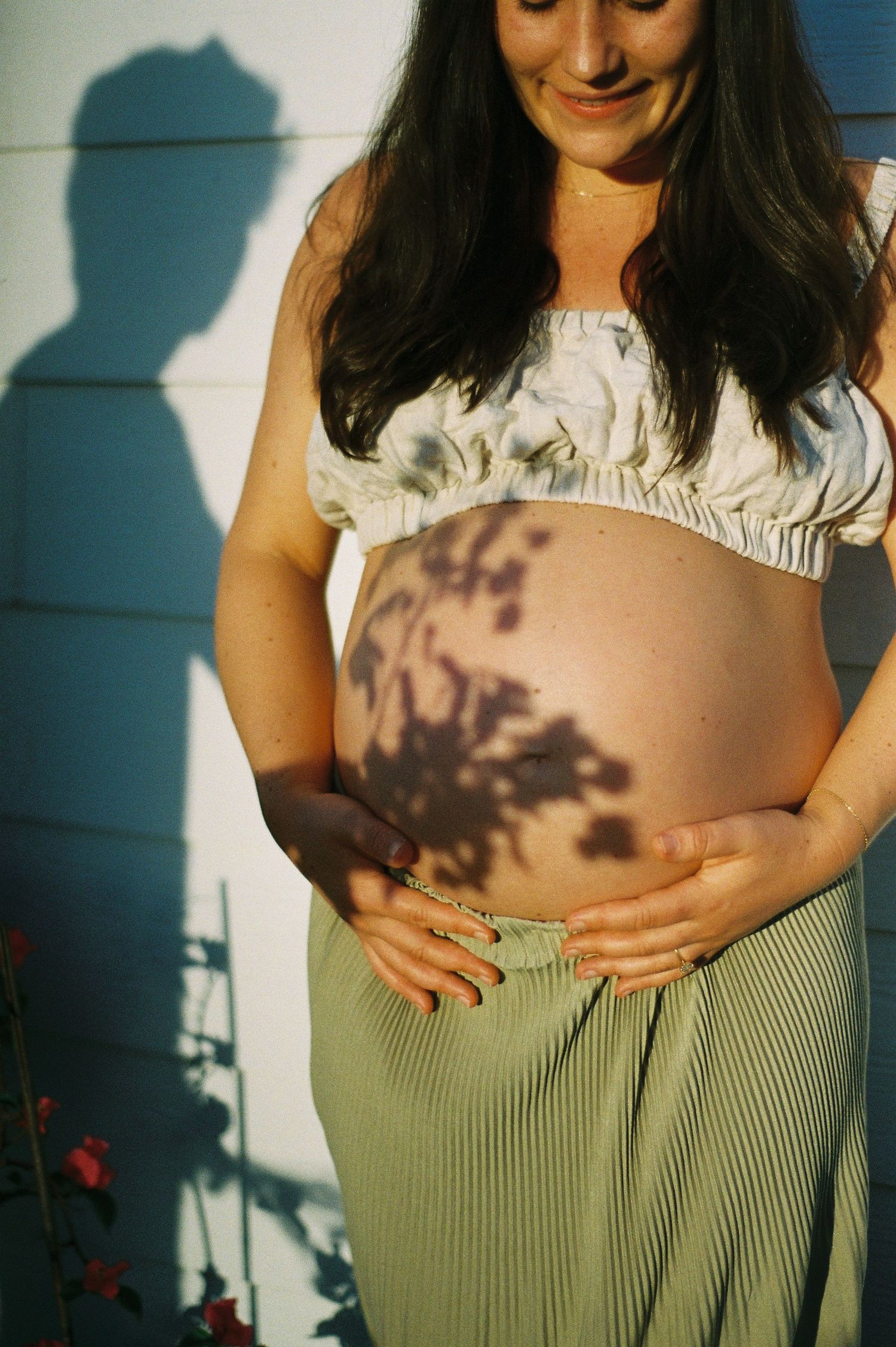 Maternity portrait of mother in natural light.