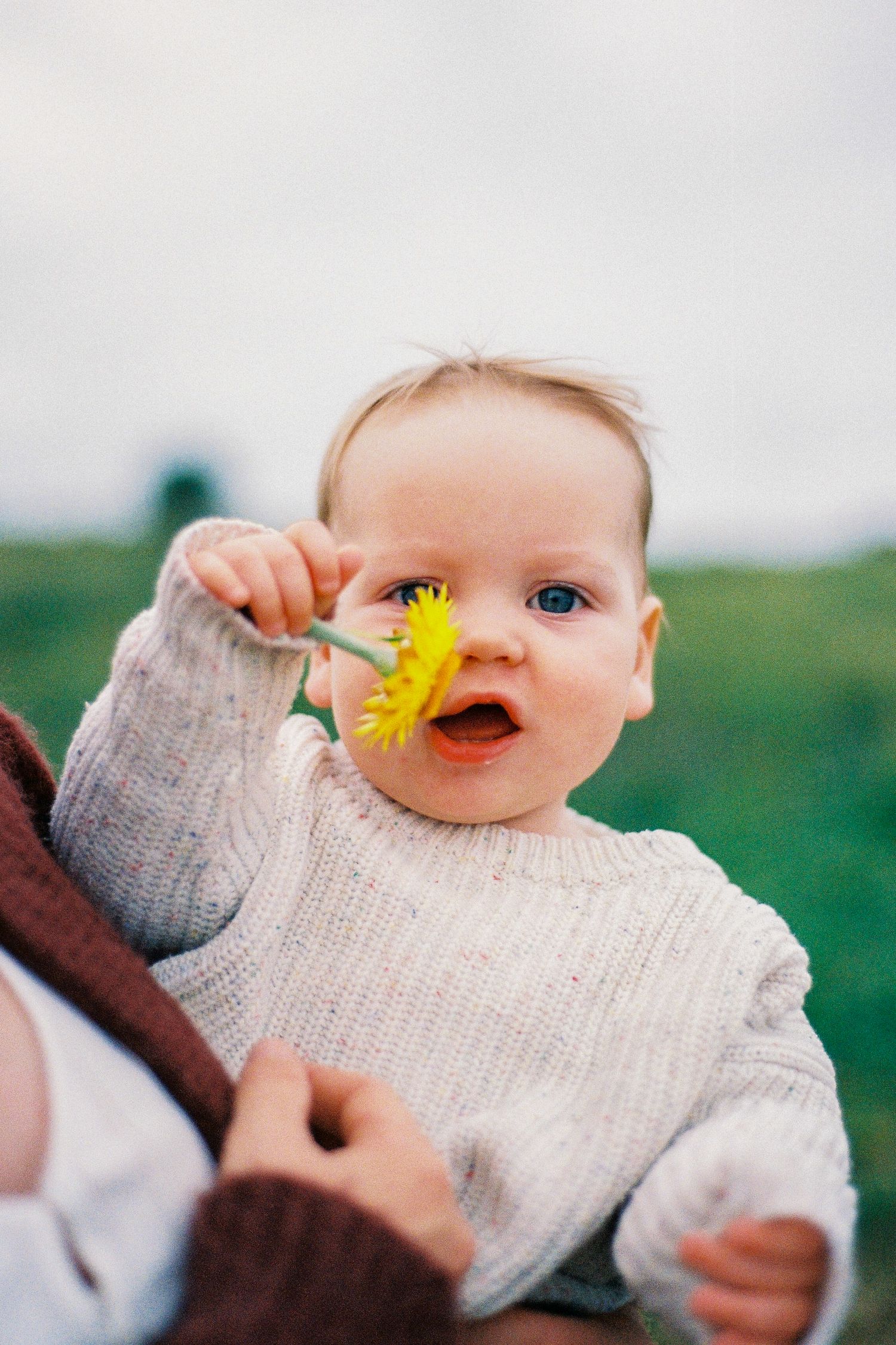 Child holding flower.