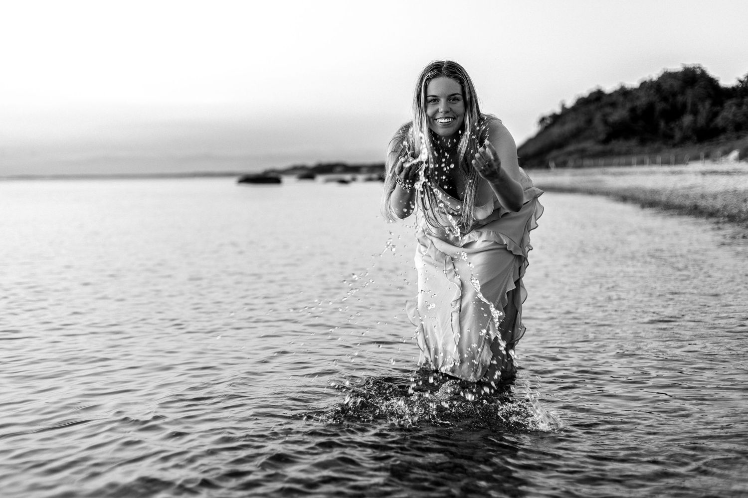 Artistic black and white beach portraits with dramatic water splashes.