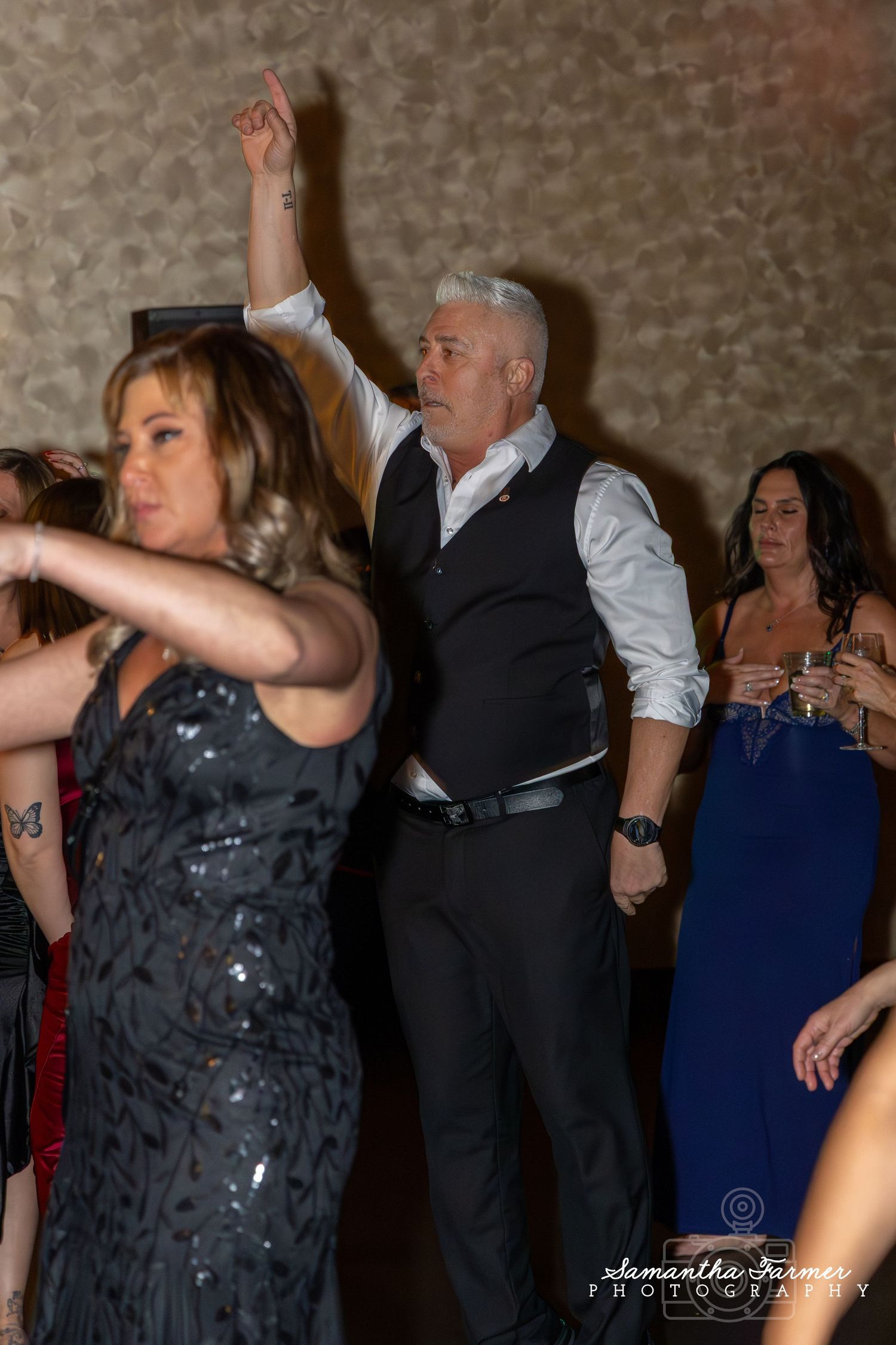 Guests dancing and socializing at an elegant evening celebration.