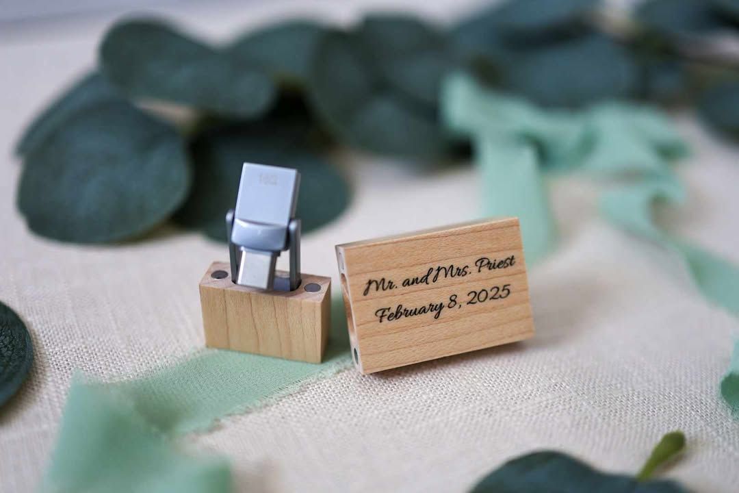 Wooden name tags and place cards arranged on textured fabric.