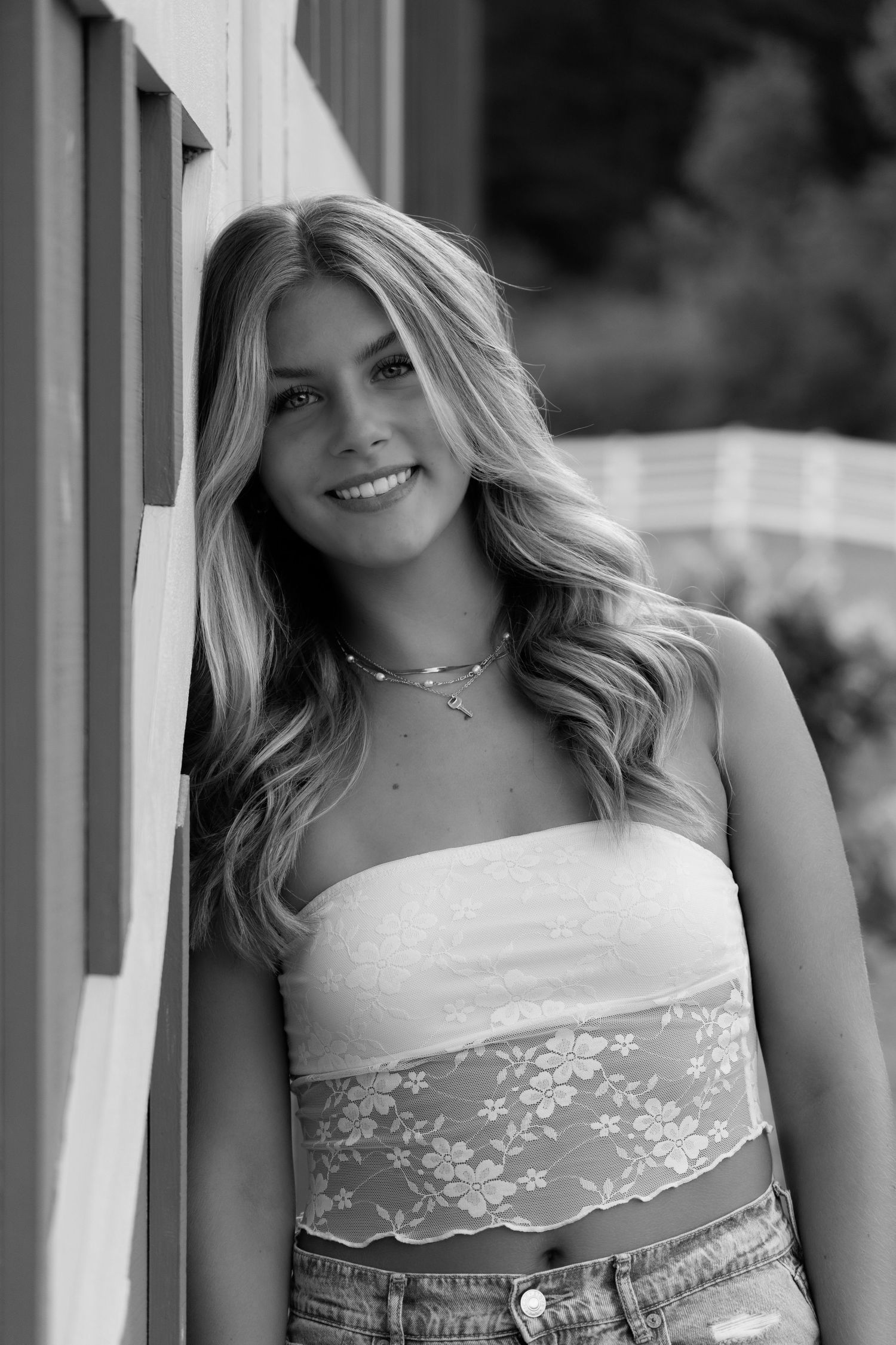 Black and white portraits in lace detailed top with soft lighting.