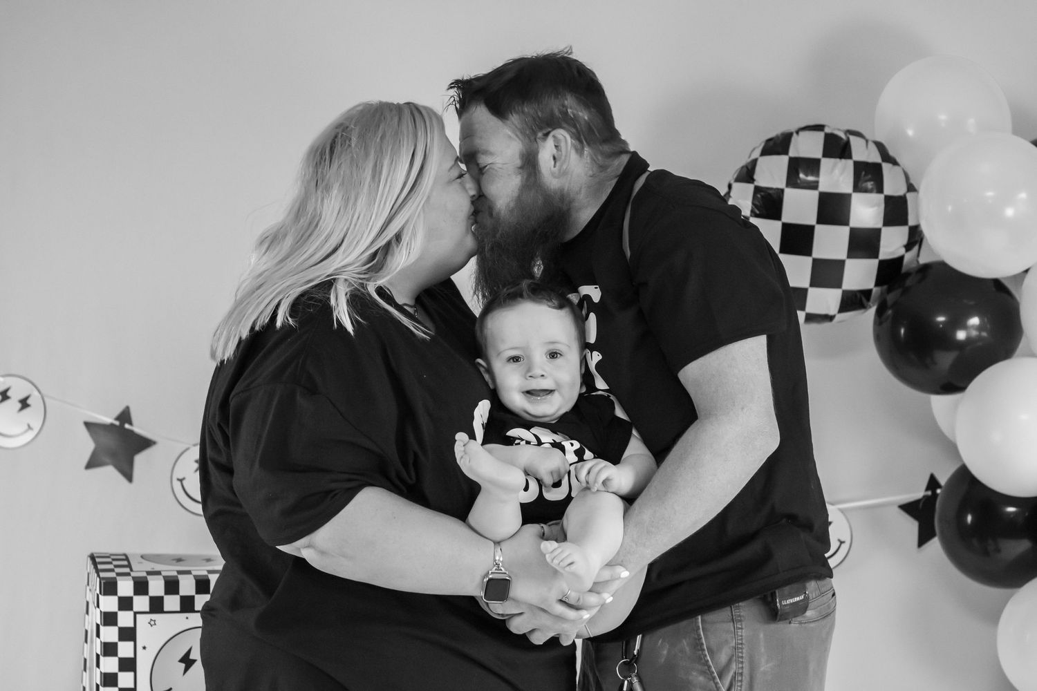 Black and white studio portraits with checkered decorations and balloons.