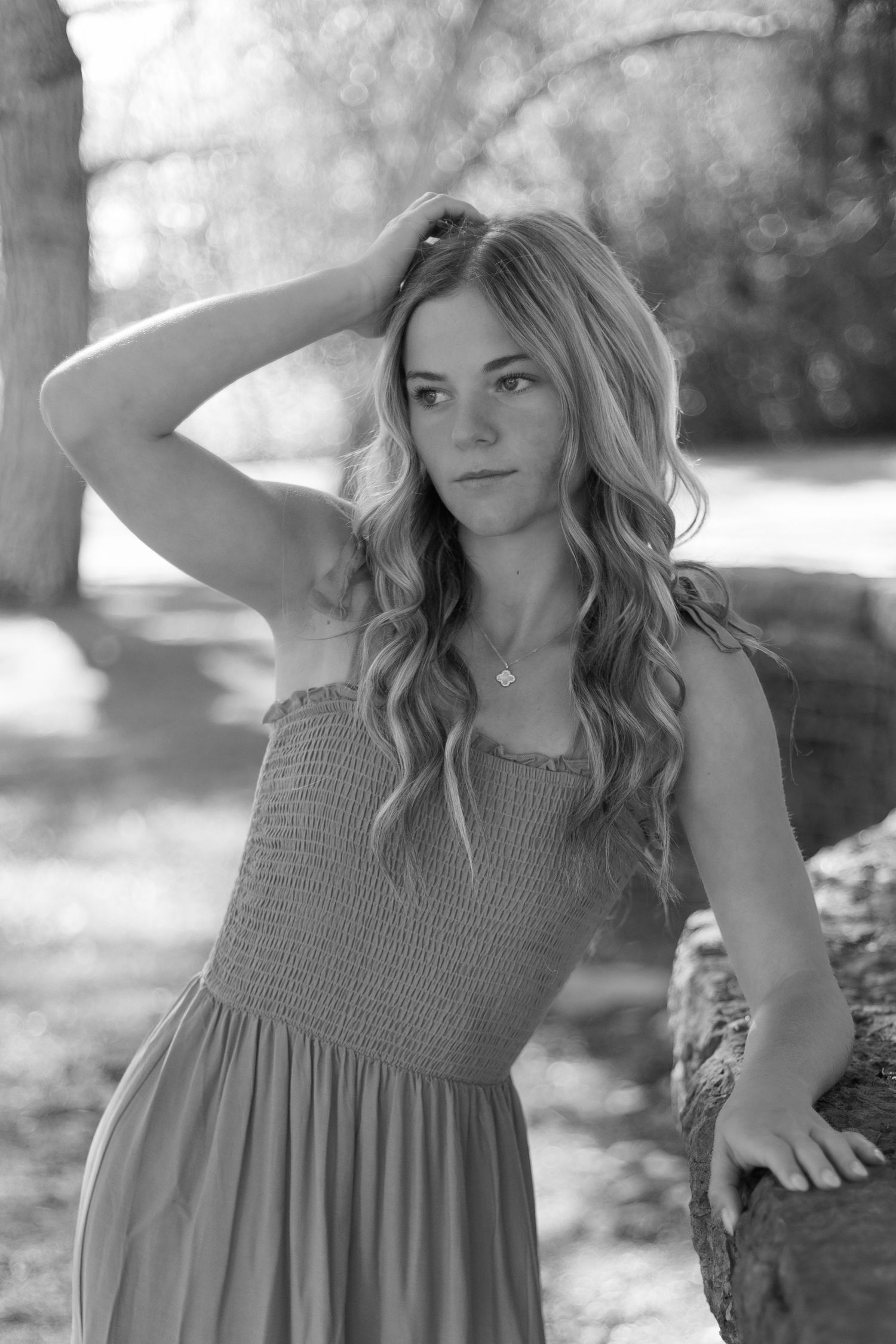 Black and white portraits featuring a textured sleeveless dress in natural lighting.