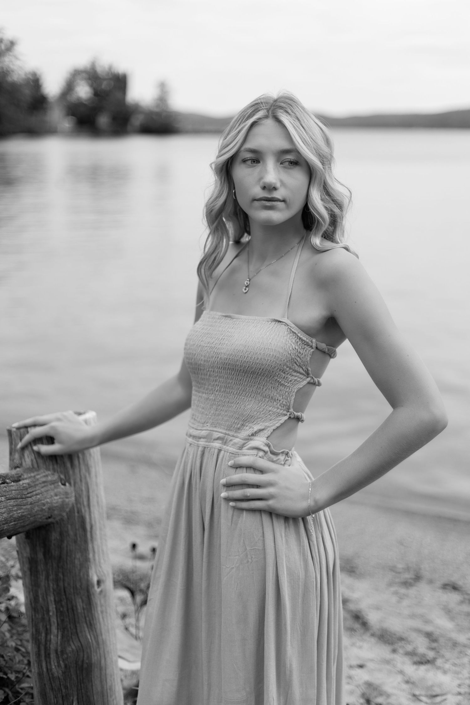 Black and white portrait series on a beach with a dreamy, ethereal quality.