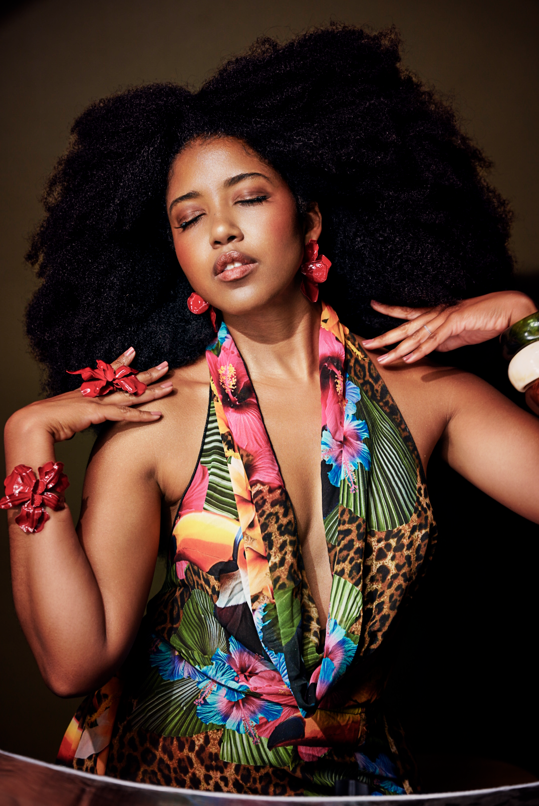Vibrant fashion portraits featuring tropical print dress with leopard patterns and colorful floral designs.
